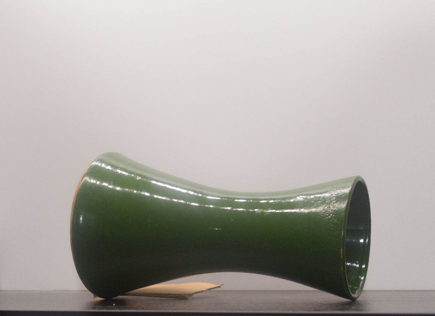 Bottom view of vintage Denby vase showing wide mouth and rim wear