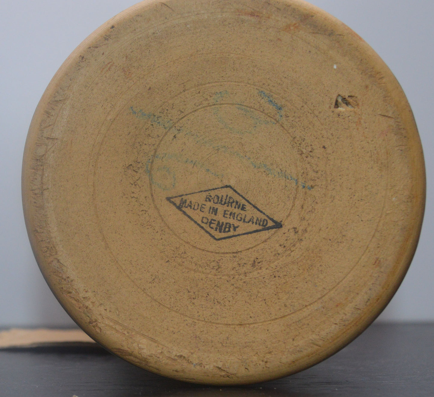 Base of Denby Bourne vase with 'Made in England' mark on unglazed ceramic.