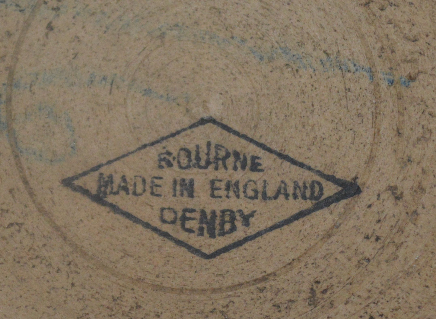 Close-up of Denby Bourne England maker’s mark in diamond stamp