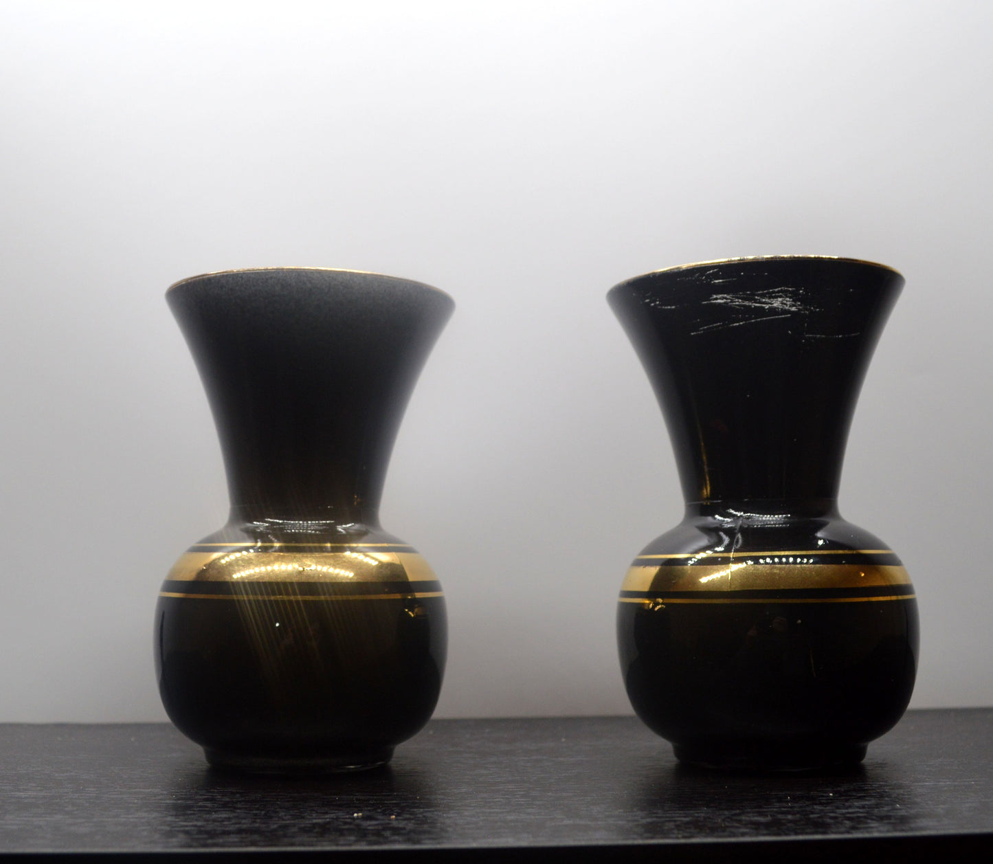 TWO VINTAGE FRENCH BLACK AND GOLD VASES