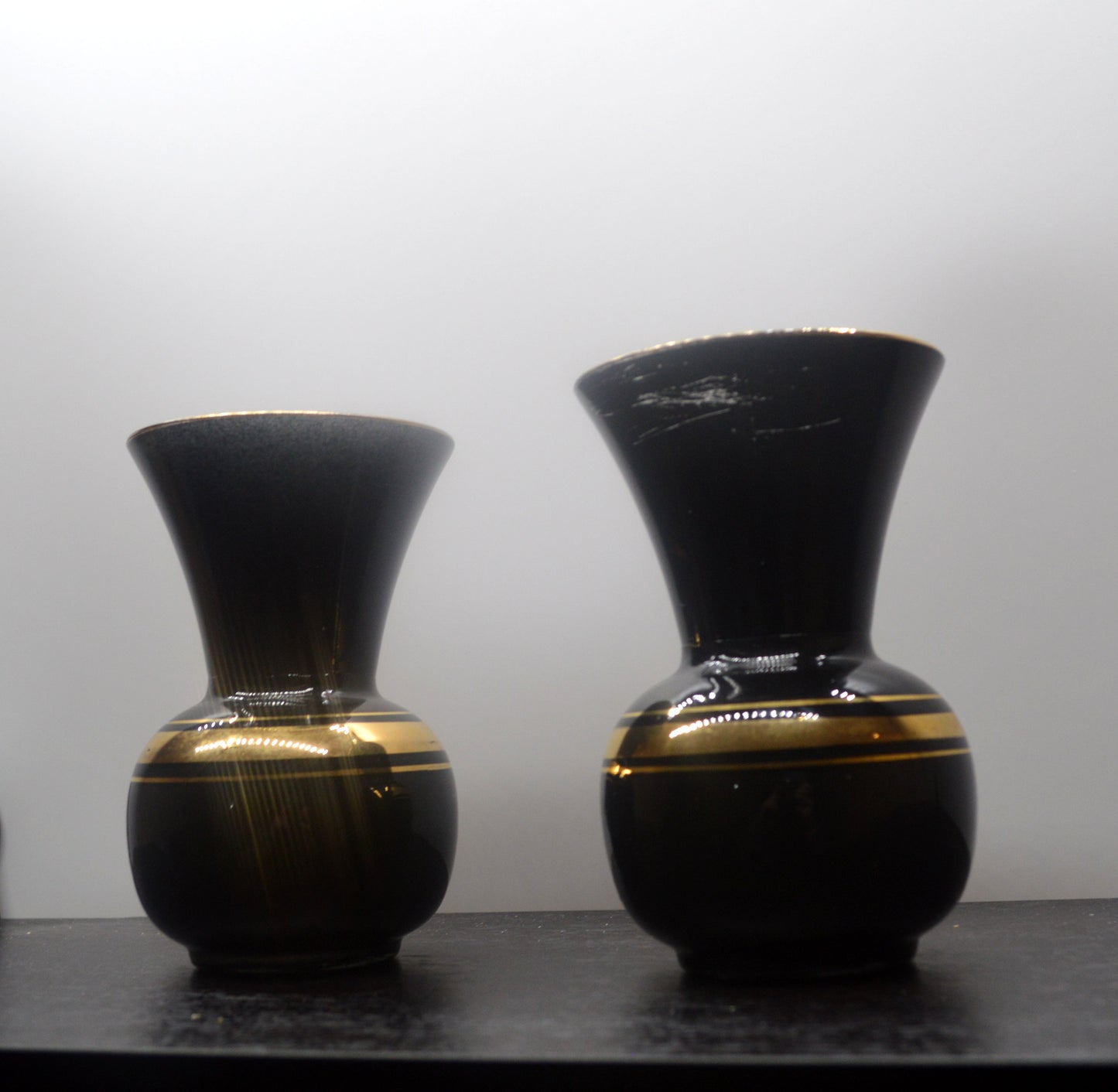 TWO VINTAGE FRENCH BLACK AND GOLD VASES