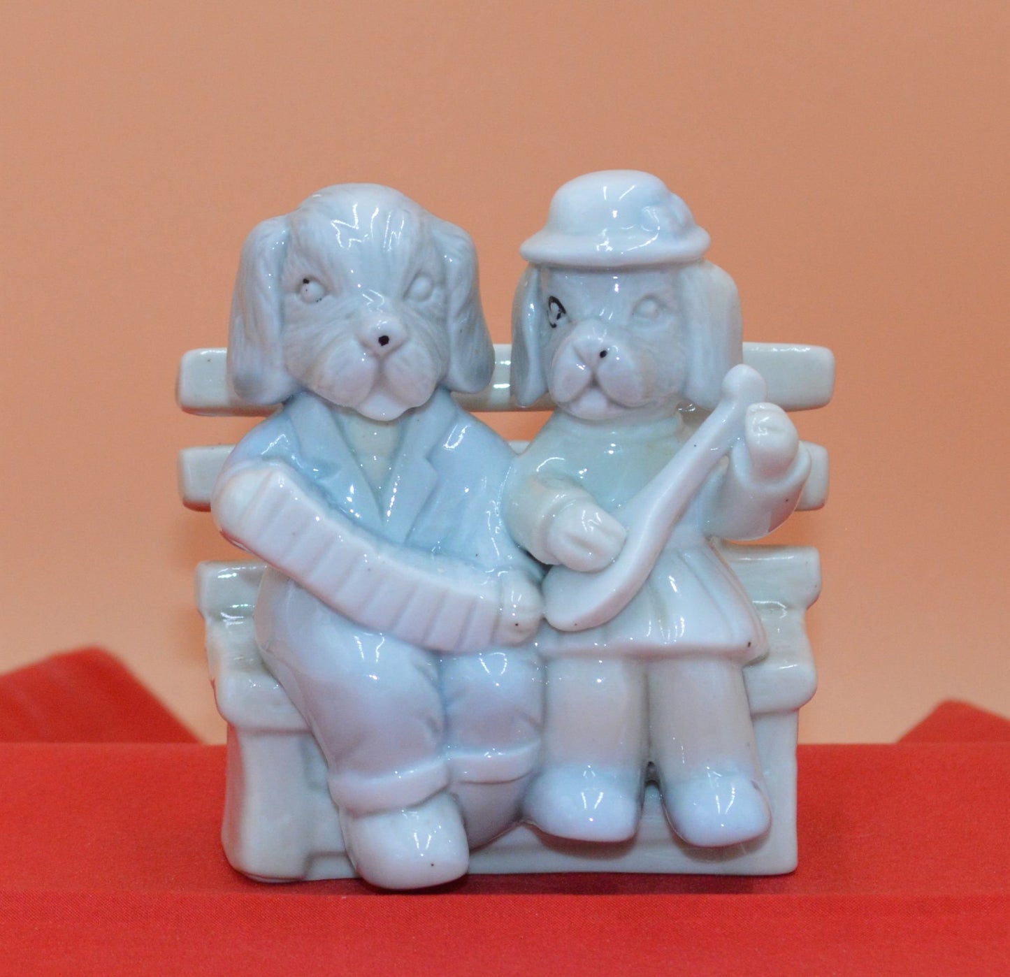 DOG COUPLE SITTING ON A BENCH - TMD167207