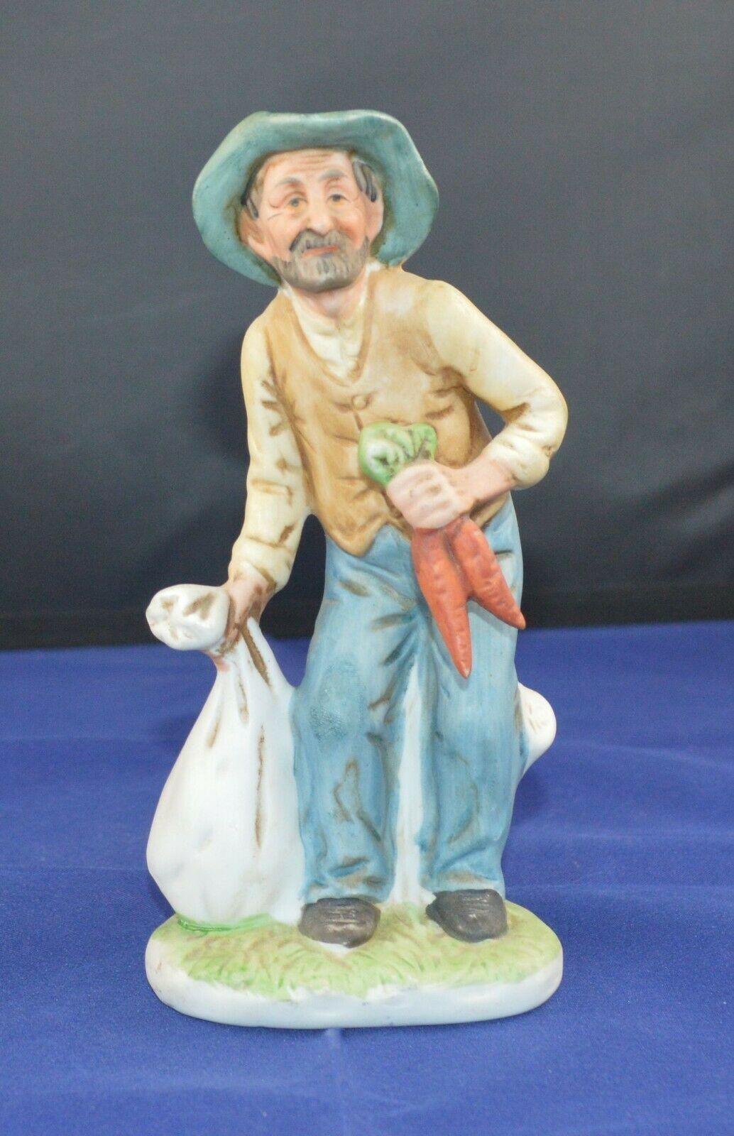 DECORATIVE FIGURINE MAN WITH CARROTS(PREVIOUSLY OWNED)GOOD CONDITION - TMD167207