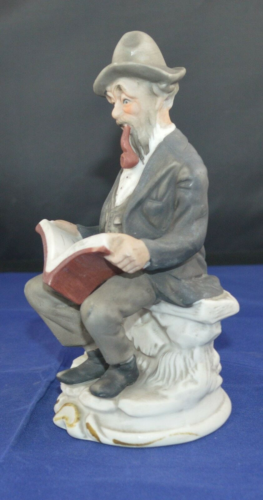 DECORATIVE FIGURINES MAN SITTING READING & A LADY IN A LILAC DRESS(PREVIOUSLY OWNED) GOOD CONDITION - TMD167207
