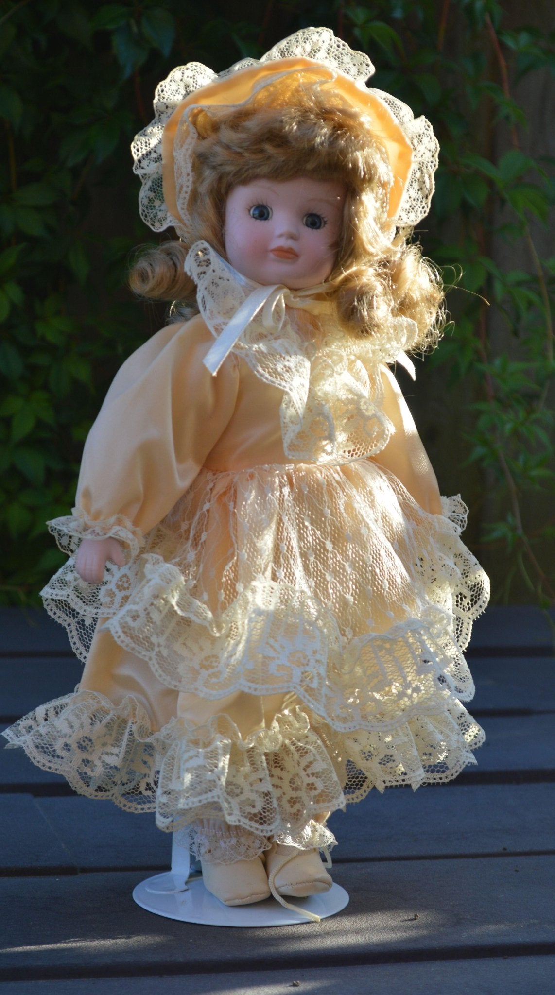 PORCELAIN DOLL IN A LIGHT PEACH DRESS - TMD167207
