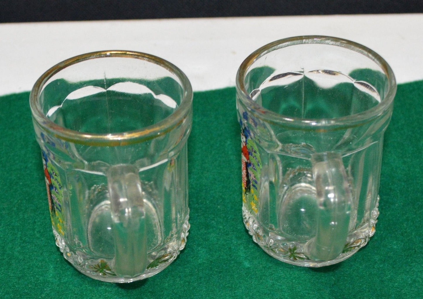 TWO MINIATURE GLASS TANKARDS DEPICTING THE TRADITIONAL COSTUME OF A WELSH LADY(PREVIOUSLY OWNED) GOOD CONDITION - TMD167207