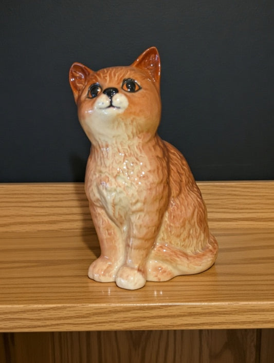 Beswick Persian ginger cat figurine model 1886, gloss ceramic finish, orange and cream colouring, sitting pose on wooden shelf, vintage collectible ornament in excellent condition