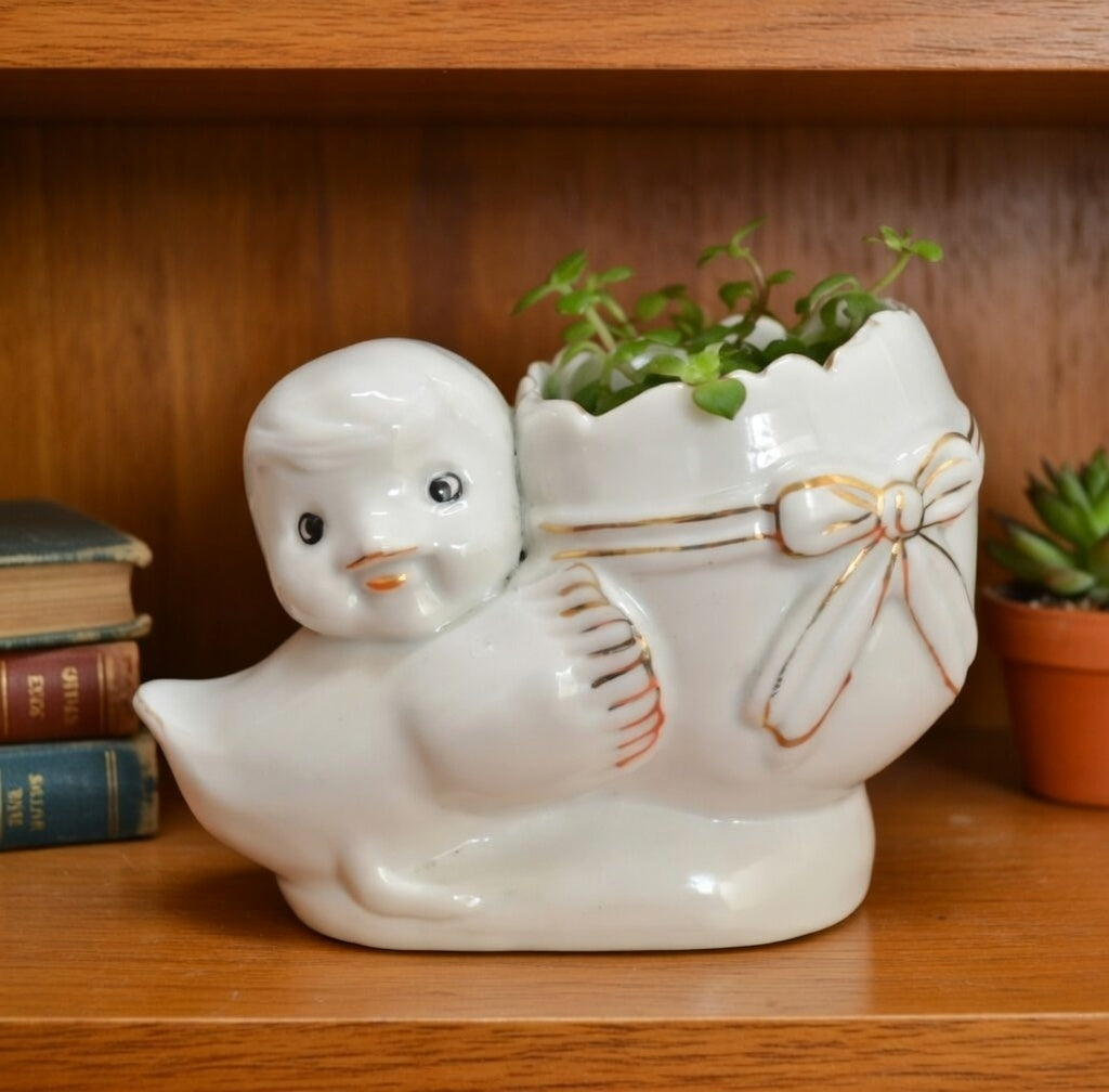 Vintage ceramic chick egg planter with small plant decorative white planter with gold trim