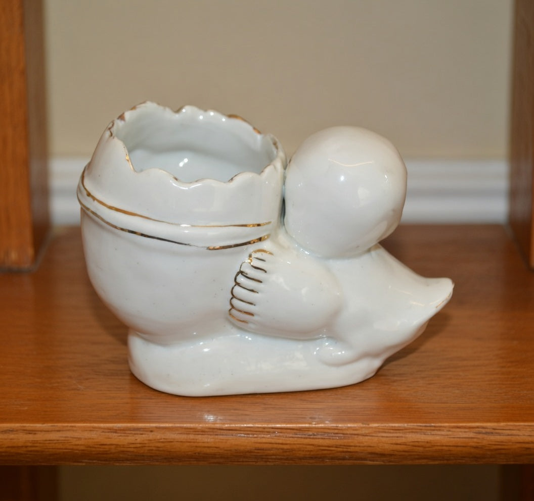 Back view of vintage ceramic chick egg planter with gold trim small decorative plant pot