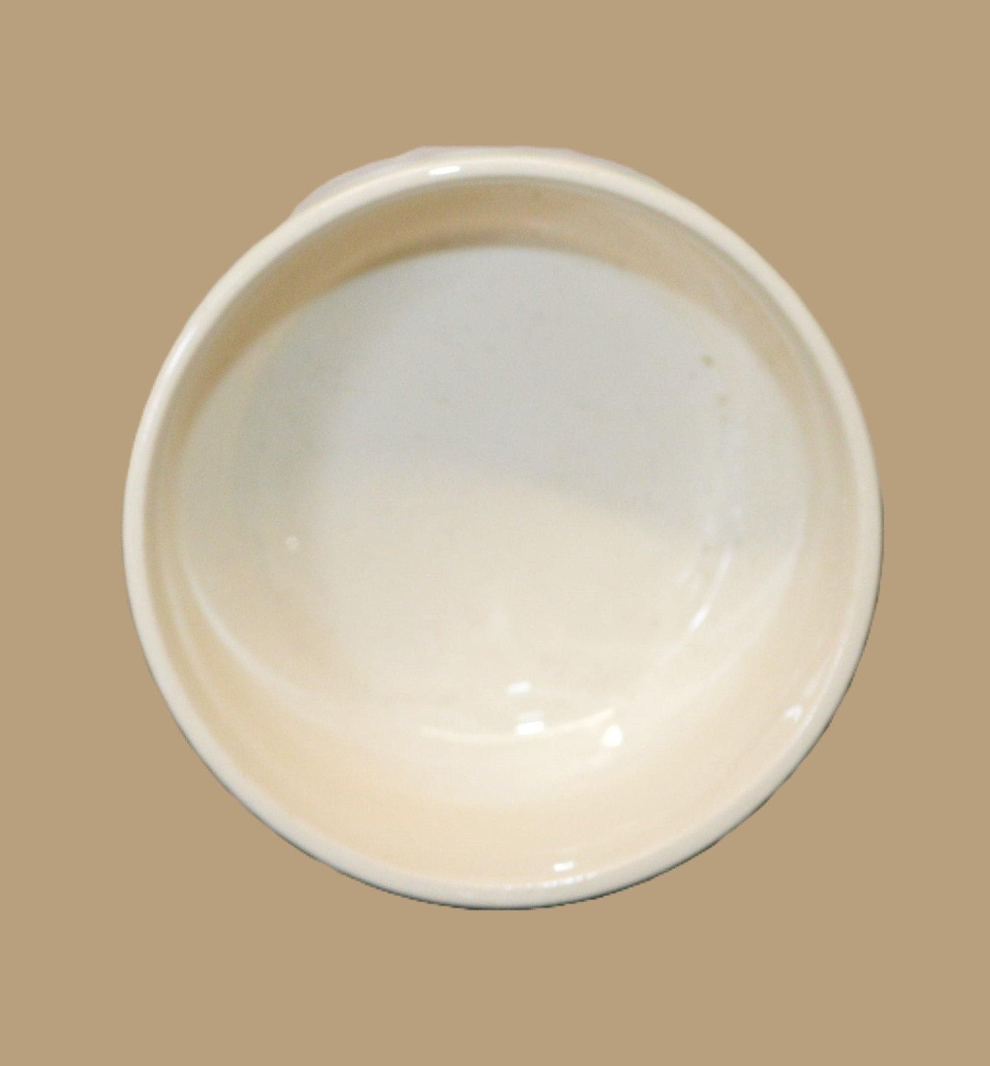 The inside of the ceramic box lid is shown, displaying a plain white surface. A small marking in red, possibly handwritten or stamped, is visible with the number "9-2" on the inner side.