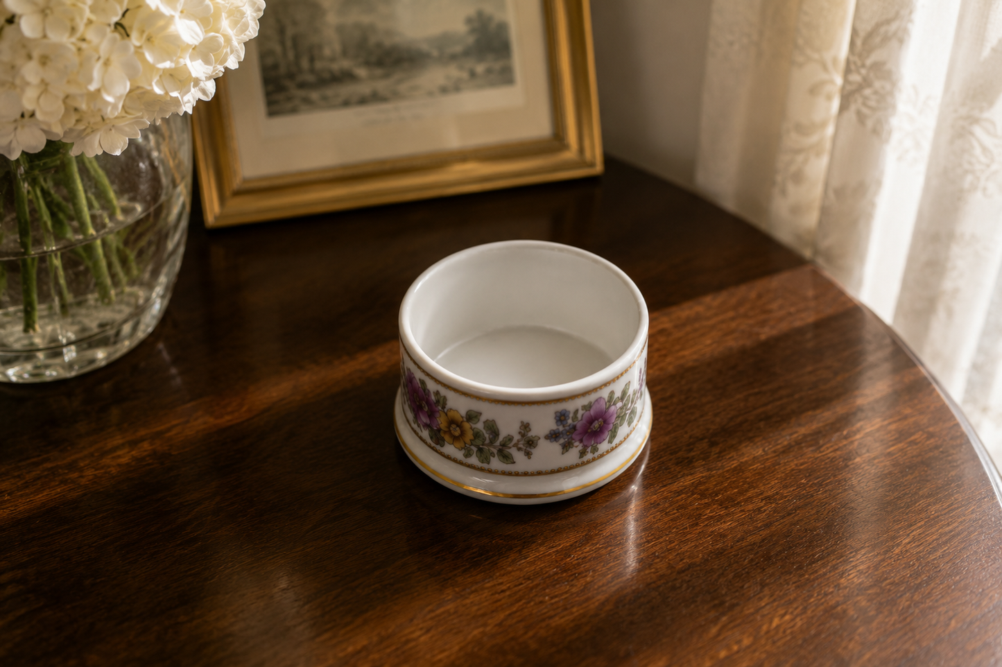 Vintage bone china Staffordshire trinket pot displayed on a wooden table in a bright home interior, showing decorative home décor styling and display inspiration.