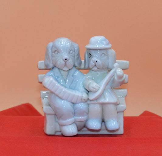 DOG COUPLE SITTING ON A BENCH - TMD167207