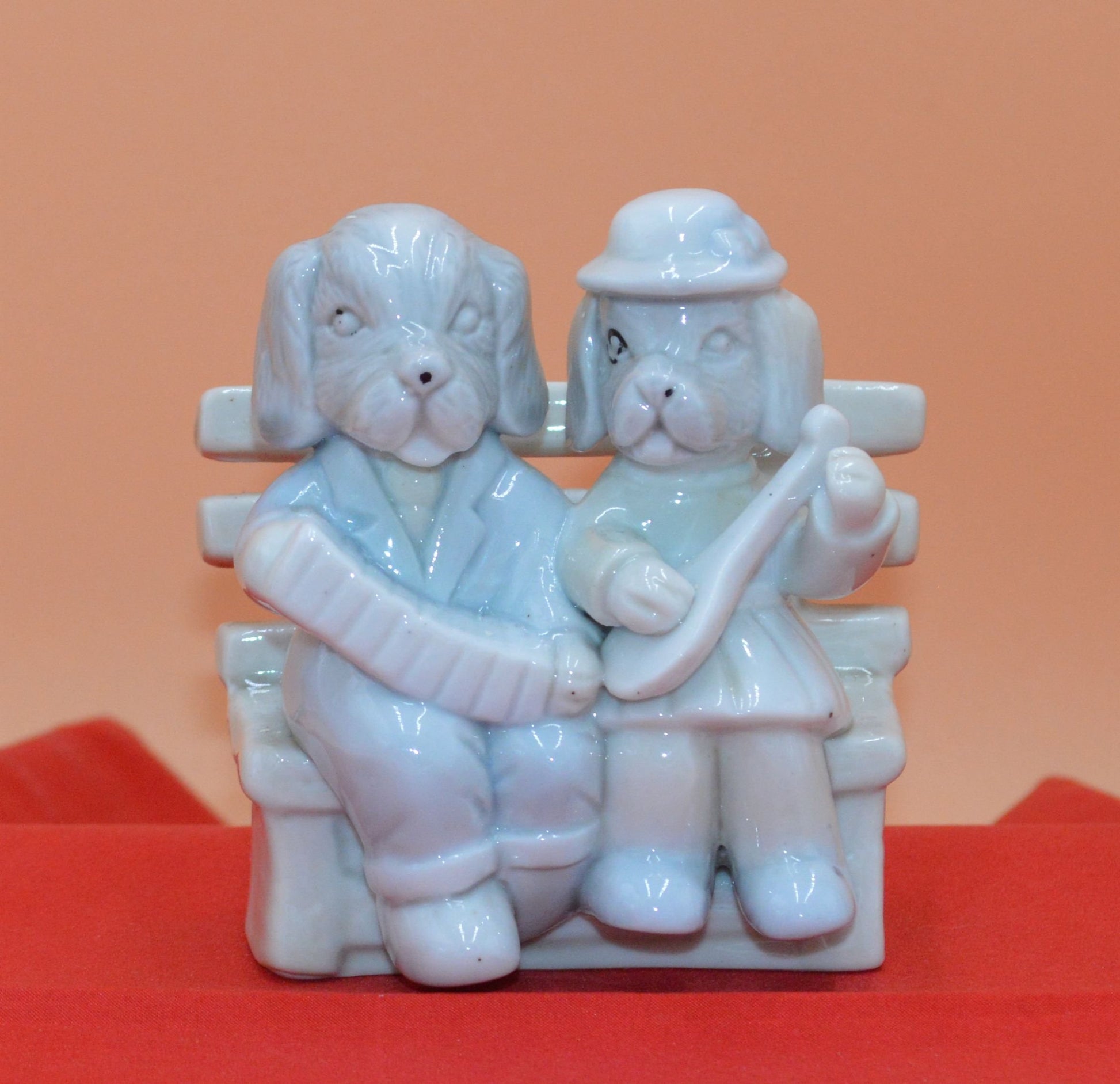 DOG COUPLE SITTING ON A BENCH - TMD167207