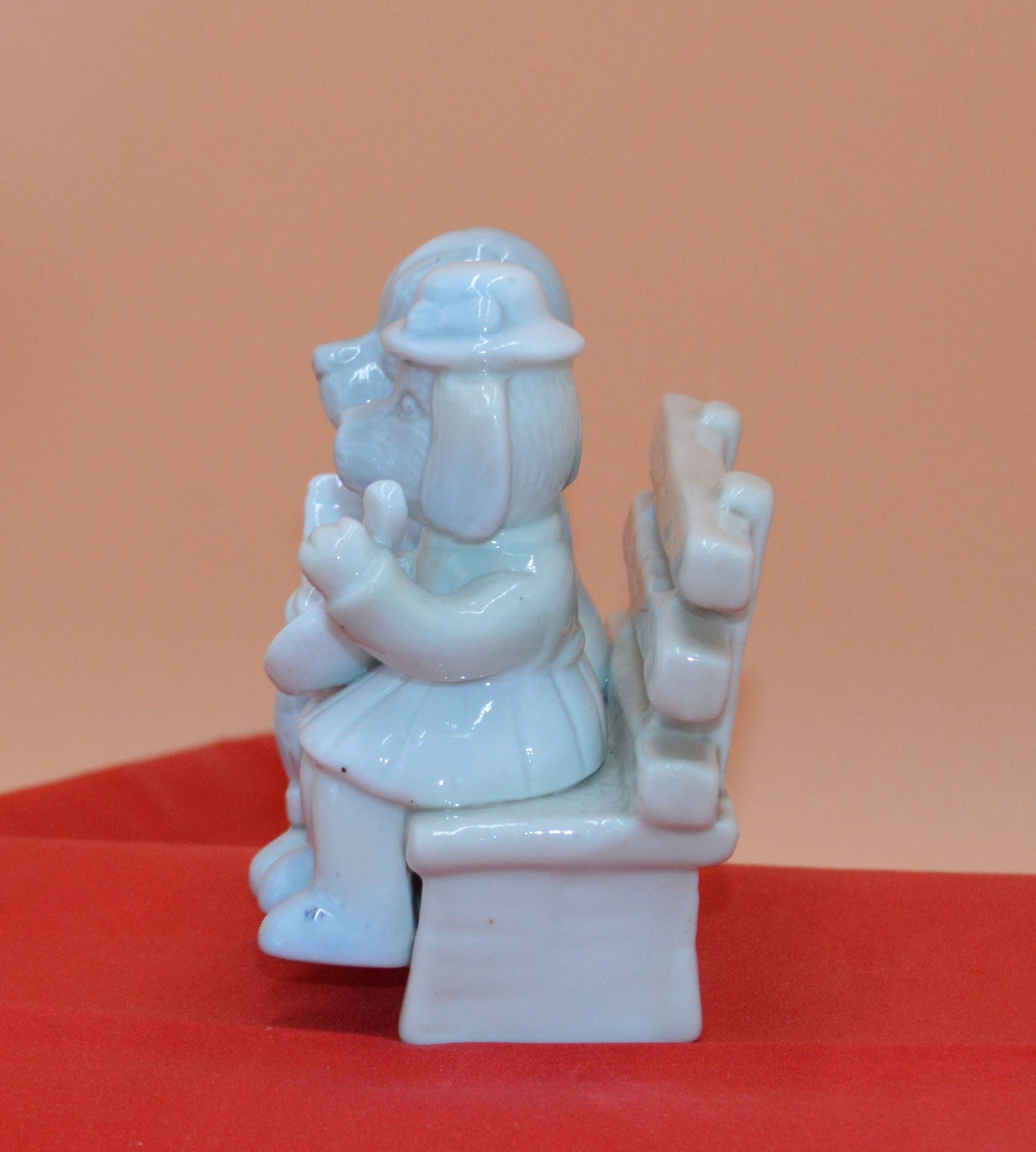 DOG COUPLE SITTING ON A BENCH - TMD167207