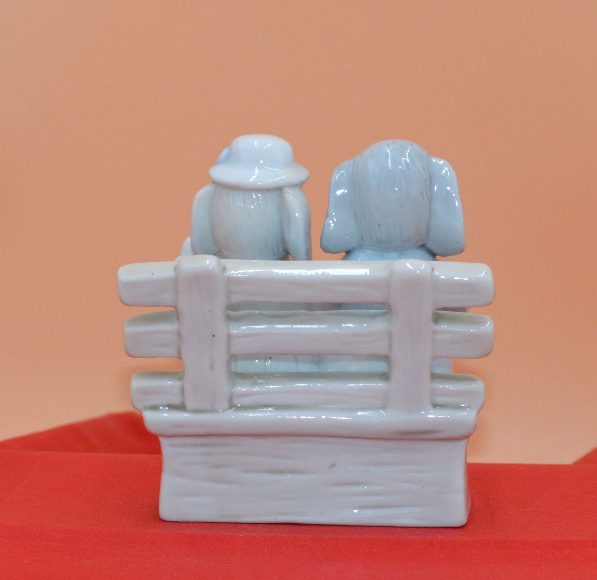 DOG COUPLE SITTING ON A BENCH - TMD167207