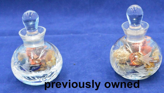 TWO GLASS BOTTLES WITH STOPPERS & POTPOURRI INSIDE