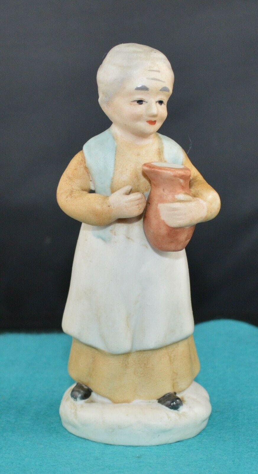 DECORATIVE FIGURINE A MALE FIGURINE SITTING CROSSED LEG & LADY FIGURINE w/JUG(PREVIOUSLY OWNED) GOOD CONDITION - TMD167207