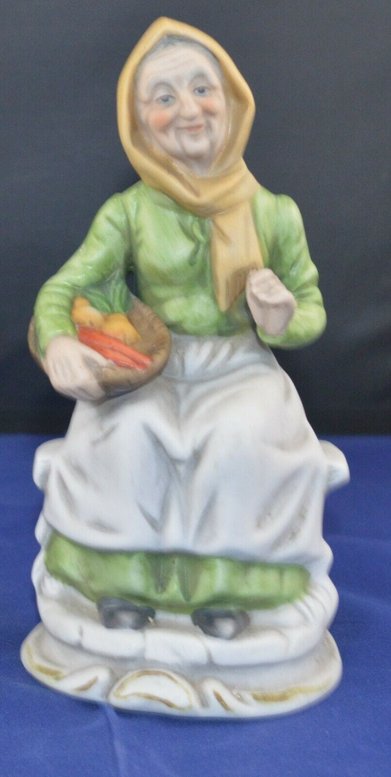 DECORATIVE FIGURINE LADY SITTING WITH A BASKET OF VEG(PREVIOUSLY OWNED)GOOD CONDITION - TMD167207