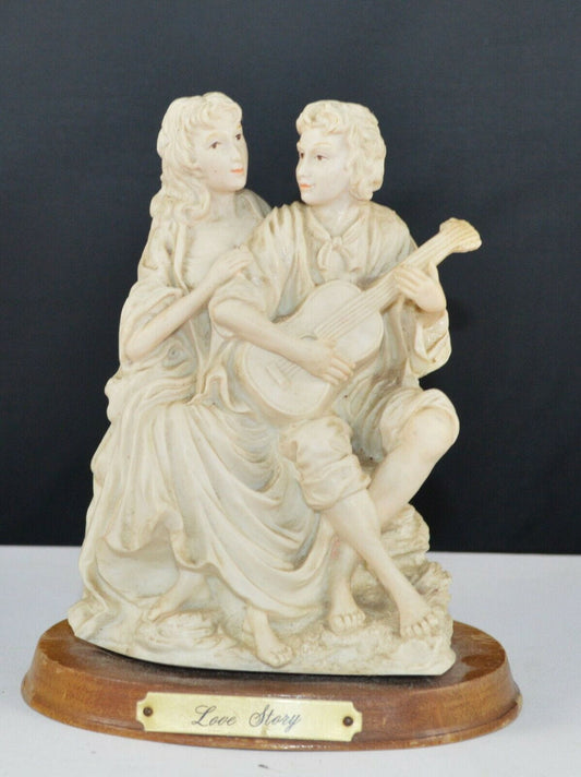 DECORATIVE FIGURINE MAN AND LADY FIGURINE ON WOODEN BASE TITLED LOVE STORY(PREVIOUSLY OWNED) GOOD CONDITION - TMD167207
