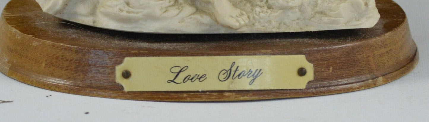 DECORATIVE FIGURINE MAN AND LADY FIGURINE ON WOODEN BASE TITLED LOVE STORY(PREVIOUSLY OWNED) GOOD CONDITION - TMD167207