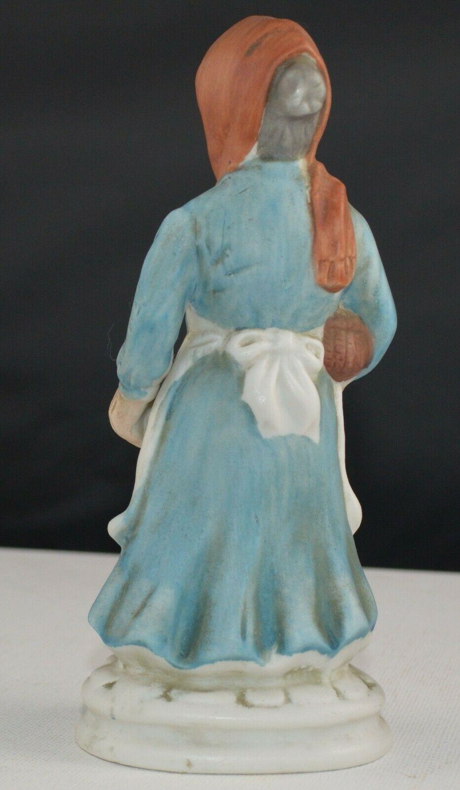 DECORATIVE FIGURINES LADY WEARING A RED HEAD SCARF & MAN WEARING A BLACK HAT(PREVIOUSLY OWNED) GOOD CONDITION - TMD167207