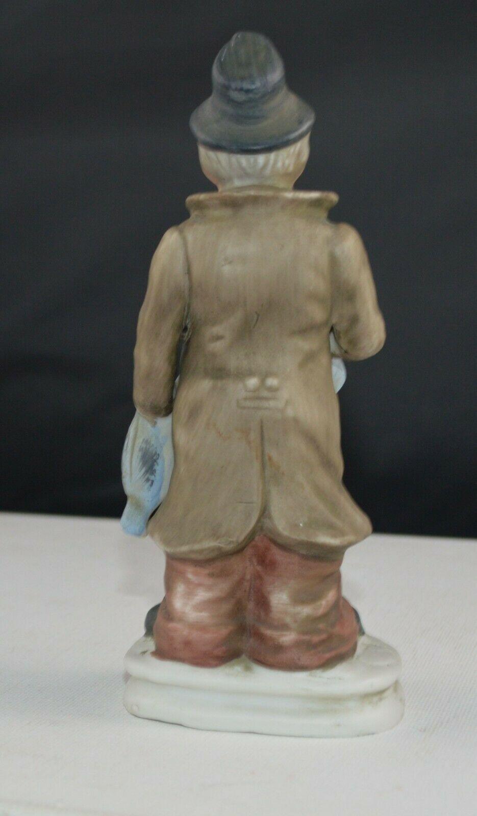 DECORATIVE FIGURINES LADY WEARING A RED HEAD SCARF & MAN WEARING A BLACK HAT(PREVIOUSLY OWNED) GOOD CONDITION - TMD167207
