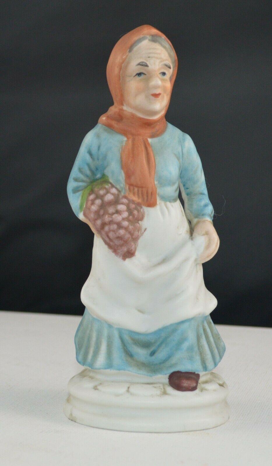 DECORATIVE FIGURINES LADY WEARING A RED HEAD SCARF & MAN WEARING A BLACK HAT(PREVIOUSLY OWNED) GOOD CONDITION - TMD167207