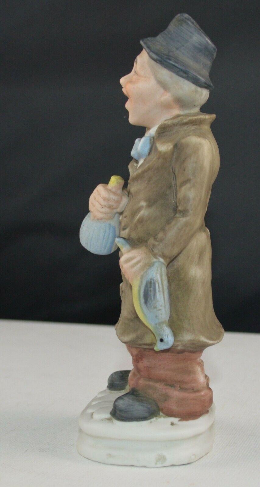 DECORATIVE FIGURINES LADY WEARING A RED HEAD SCARF & MAN WEARING A BLACK HAT(PREVIOUSLY OWNED) GOOD CONDITION - TMD167207