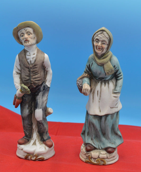 TWO DECORATIVE FIGURINES MAN WITH CARROTS LADY WITH BASKET - TMD167207